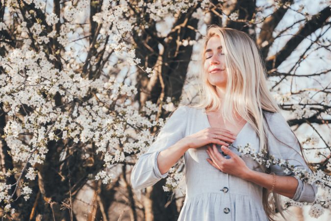 Woman Breathing near a Tree 