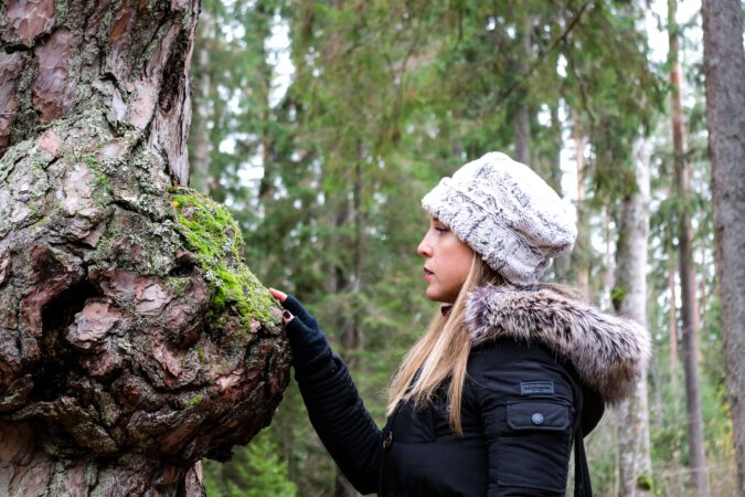 Woman Touch the Bark of a tree