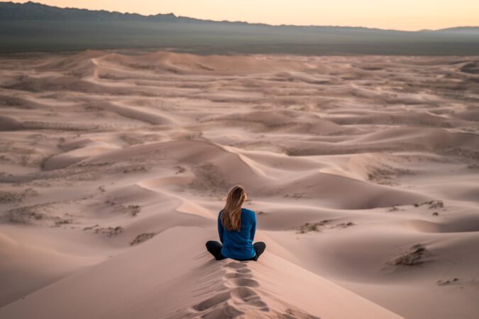 Woman meditation in the desert